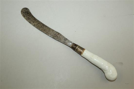 An early English porcelain white glazed moulded knife handle, 23cm